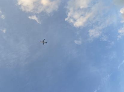 Plane flying over Miami Beach 35th street