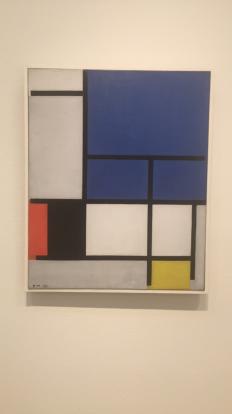 Piet Mondrian artist - Composition with large blue plane, red, black, yellow, and gray