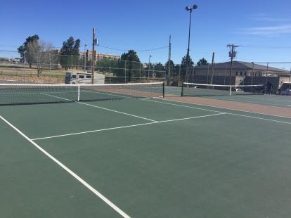 Four tennis courts at Memorial Park with lights.
