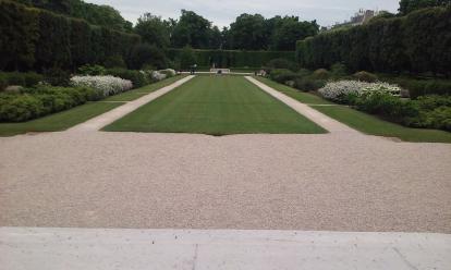 The Central garden at the Musee Rodin. There are a few statues at the end of the walkway a